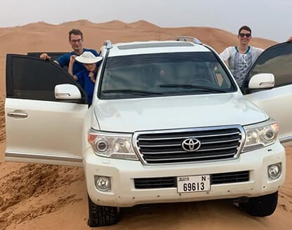 Red dune safari with sandboarding, camel ride & bbq